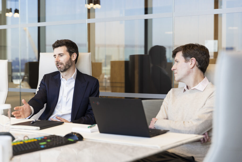 two people sitting in a meeting room